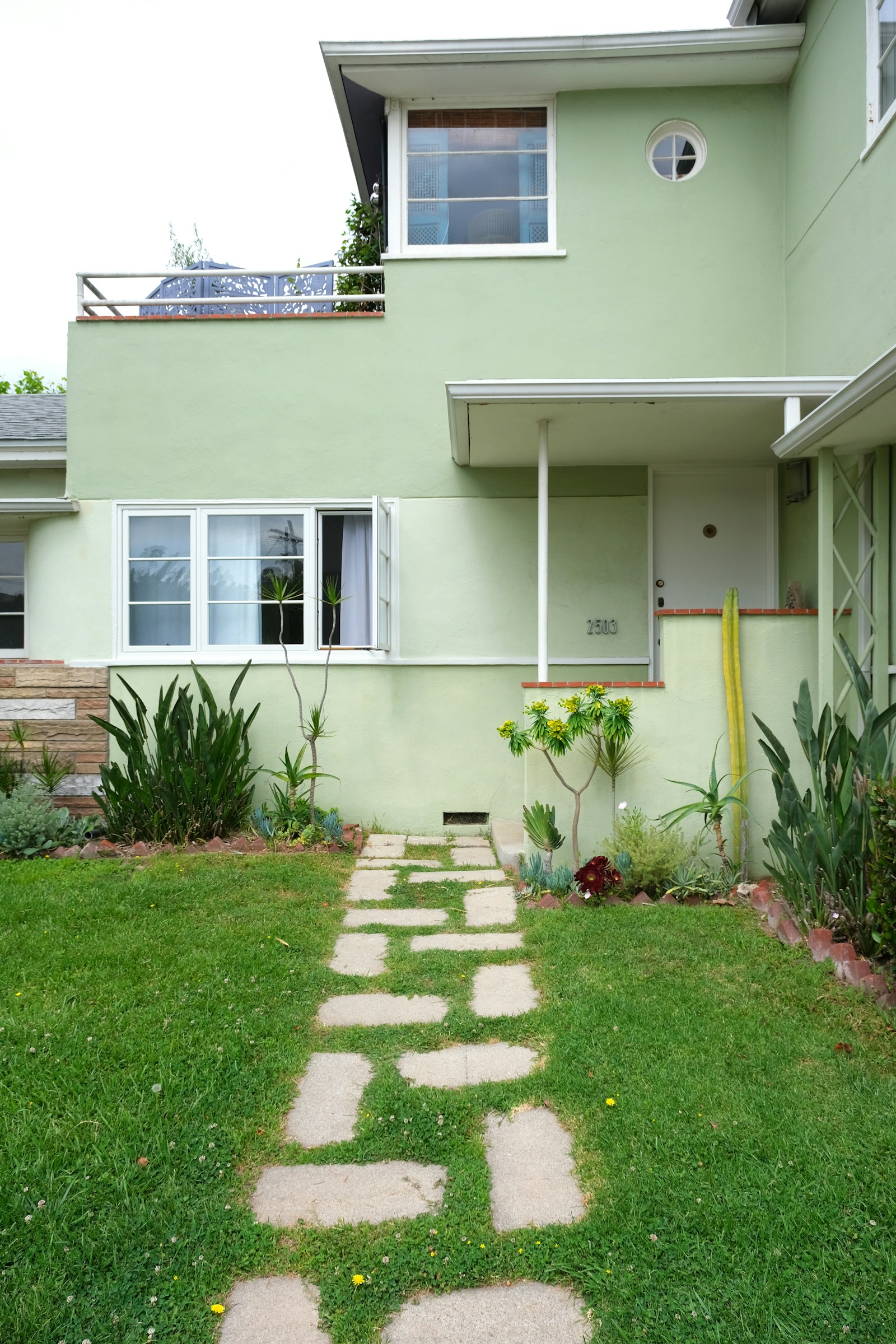 Clean green lawn in front of a well-kept home